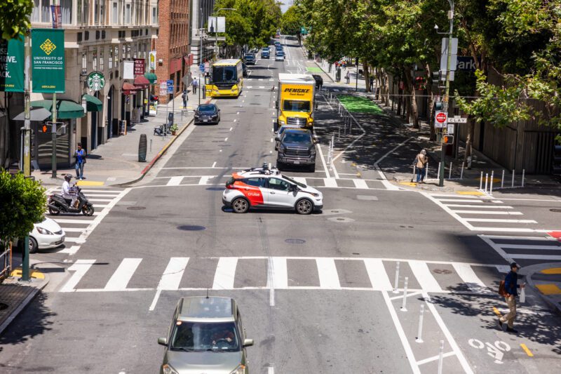 Cruise self-driving taxi in the centre of an intersection in San Francisco after driving through a red light.