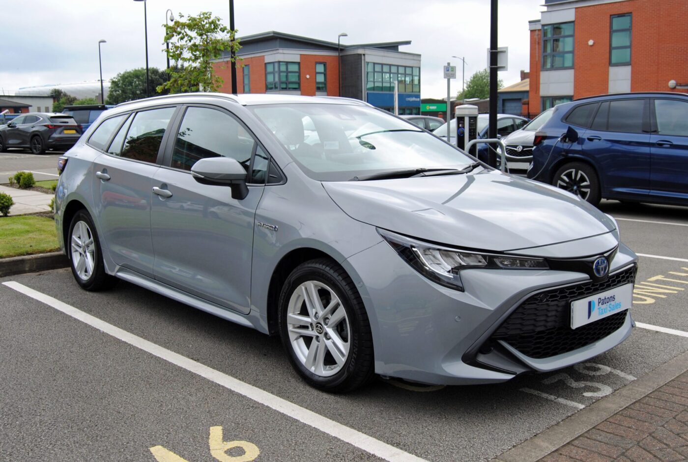 Grey Toyota Corolla front right side view