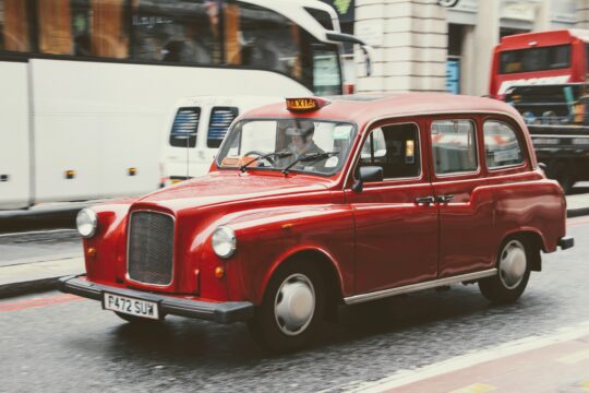 non- ULEV compliant hackney cab in a red colour.