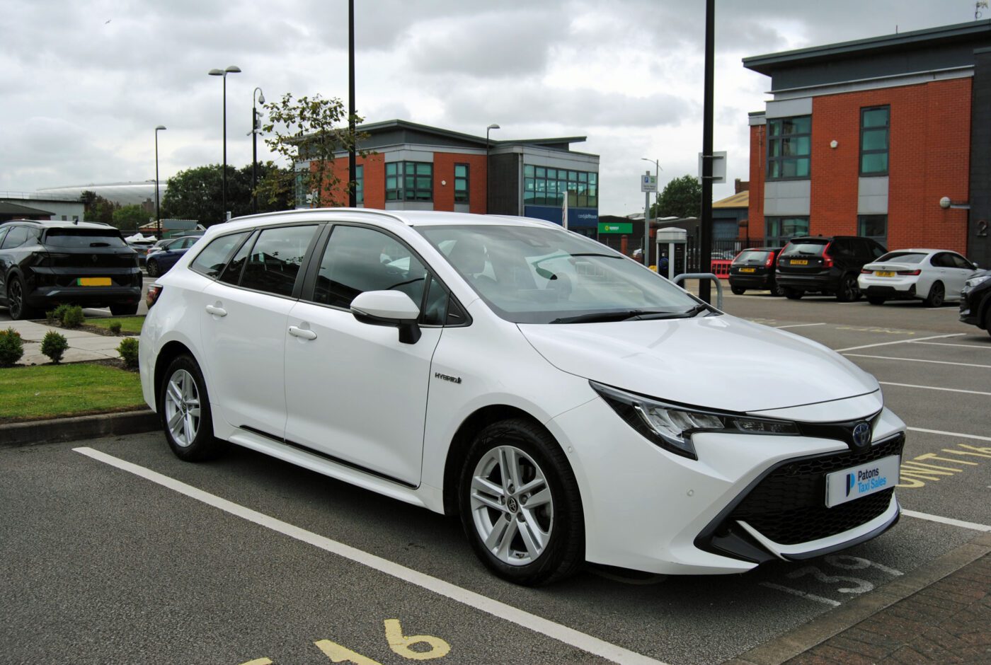 White Toyota Corolla 1.8 Icon hybrid automatic. Front side view